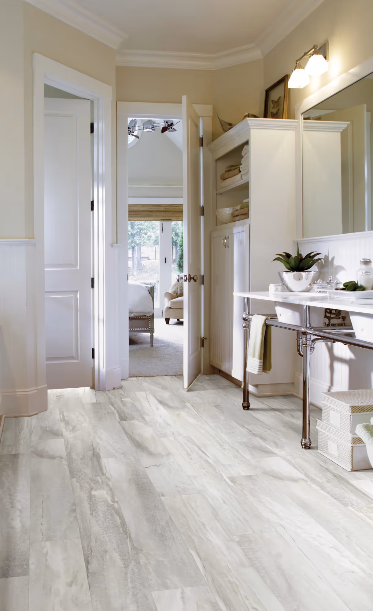 A light grey linoleum floor in an elegant period bathroom.