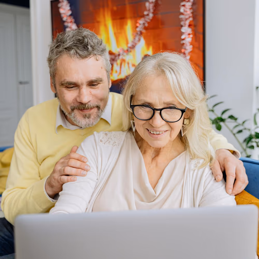 A couple on a virtual meeting via their laptop