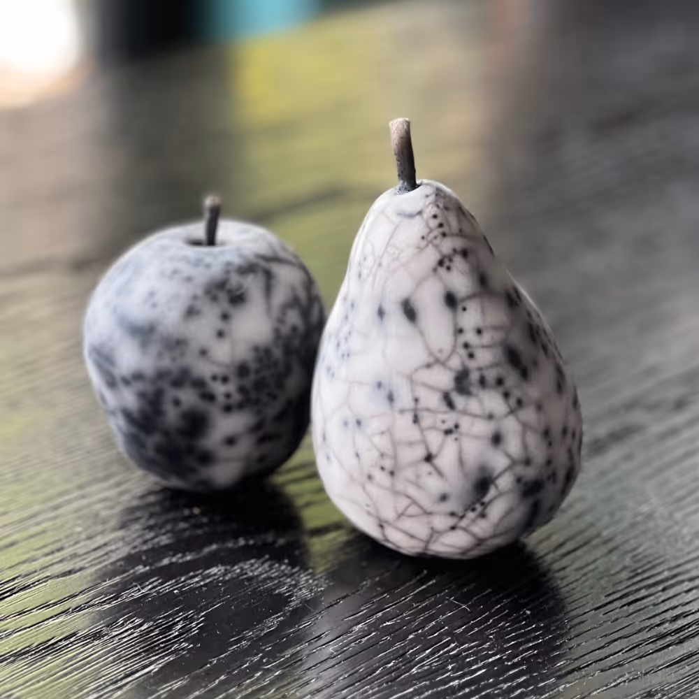 A raku fired apple and pear