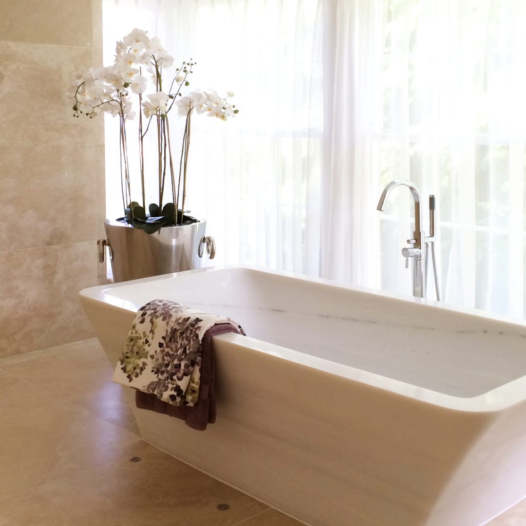 Large marble bath in a guest ensuite bathroom