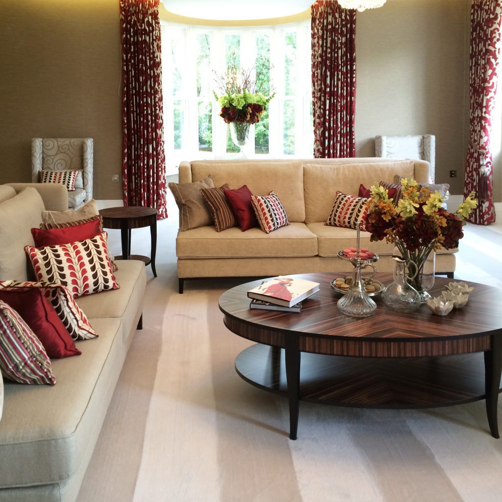 Elegant drawing room furnished in cream, red and gold