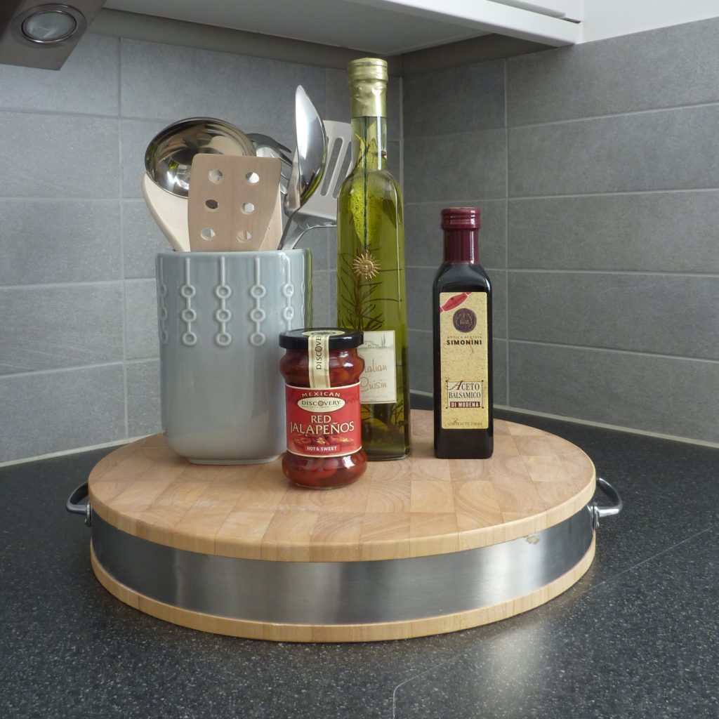 Bamboo chopping board with oil and spice bottles