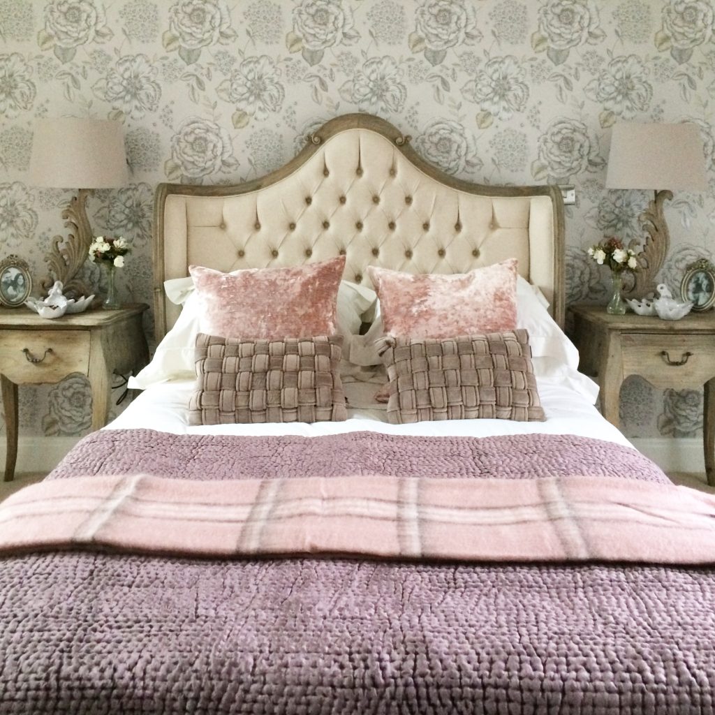 Feminine pink and taupe bedroom with French style reclaimed pine furniture