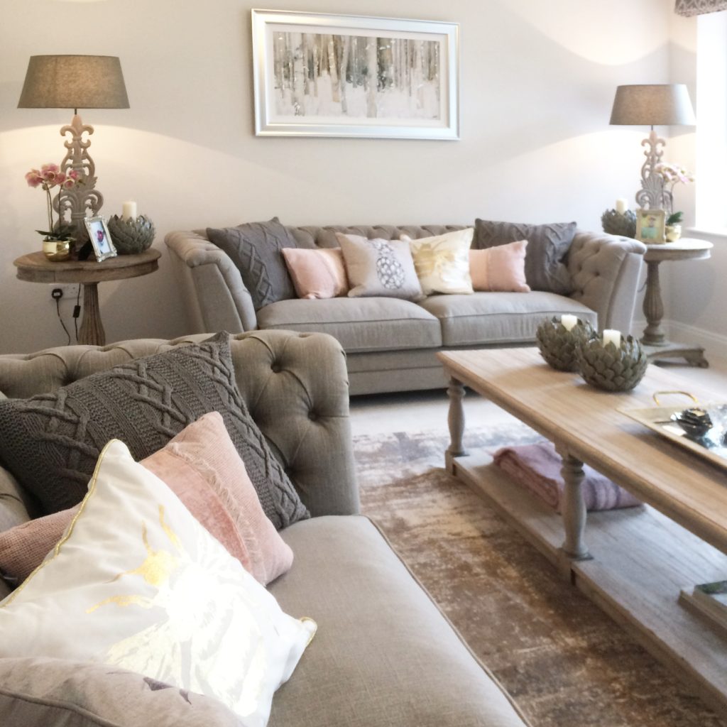 Living room in a family room, decorated in taupe and pink