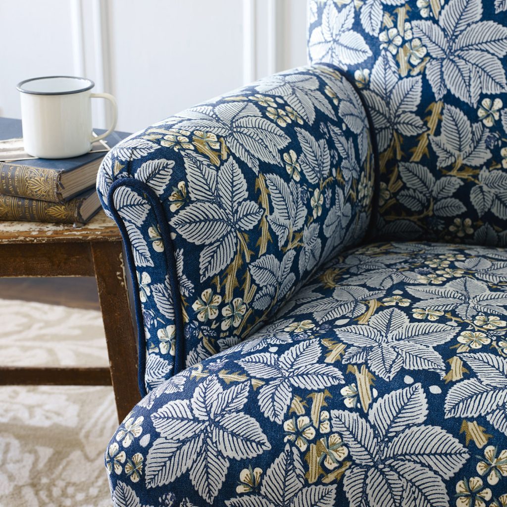 Armchair upholstered in blue and white leaf design