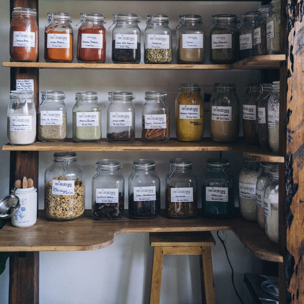 Pantry shelving with jars of zero waste refill ingredients