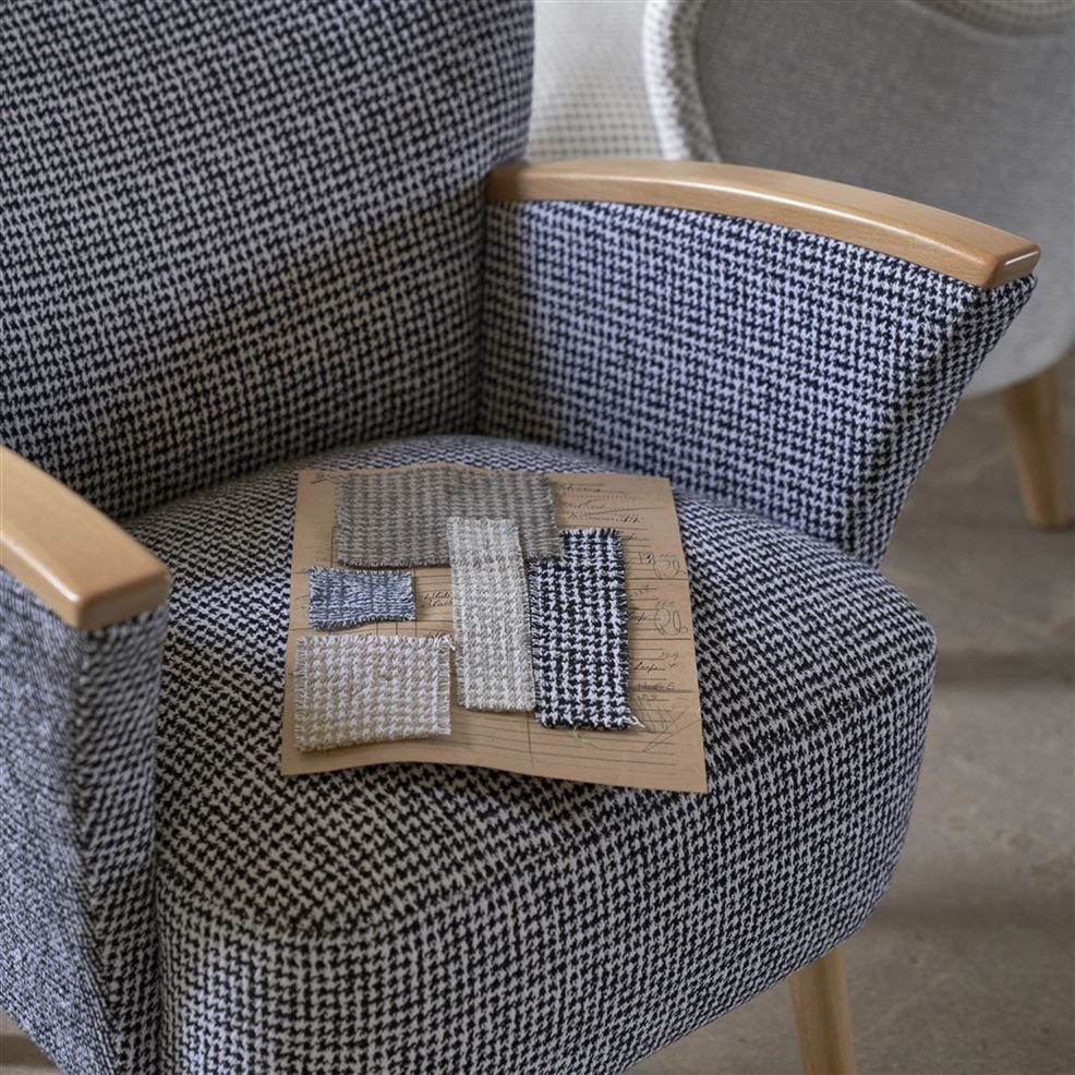 Modern side chair upholstered in a recycled cotton and recycled polyester fabric