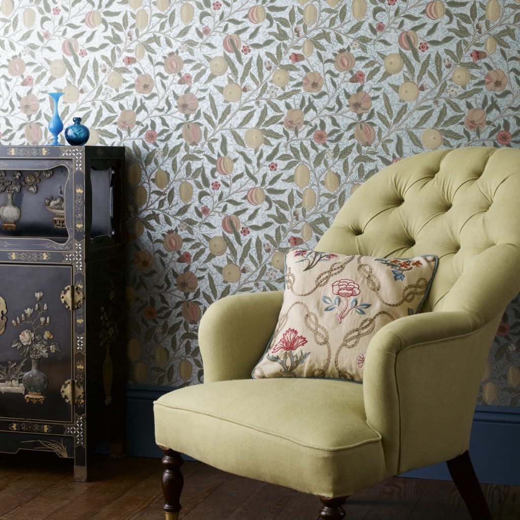 Classic surface printed wallpaper with a pretty yellow upholstered occasional chair