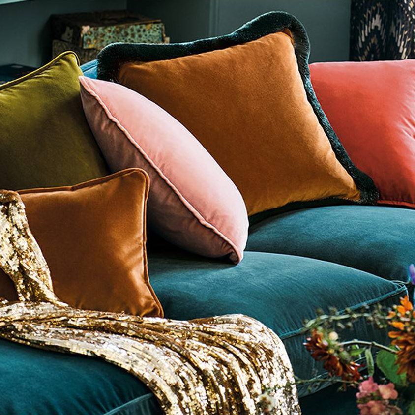 Assorted velvet cushions in rich, jewel colors