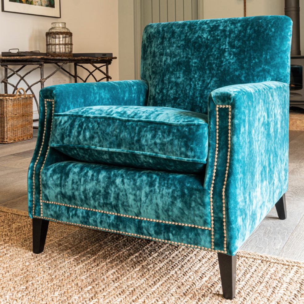 Armchair upholstered in teal crushed velvet