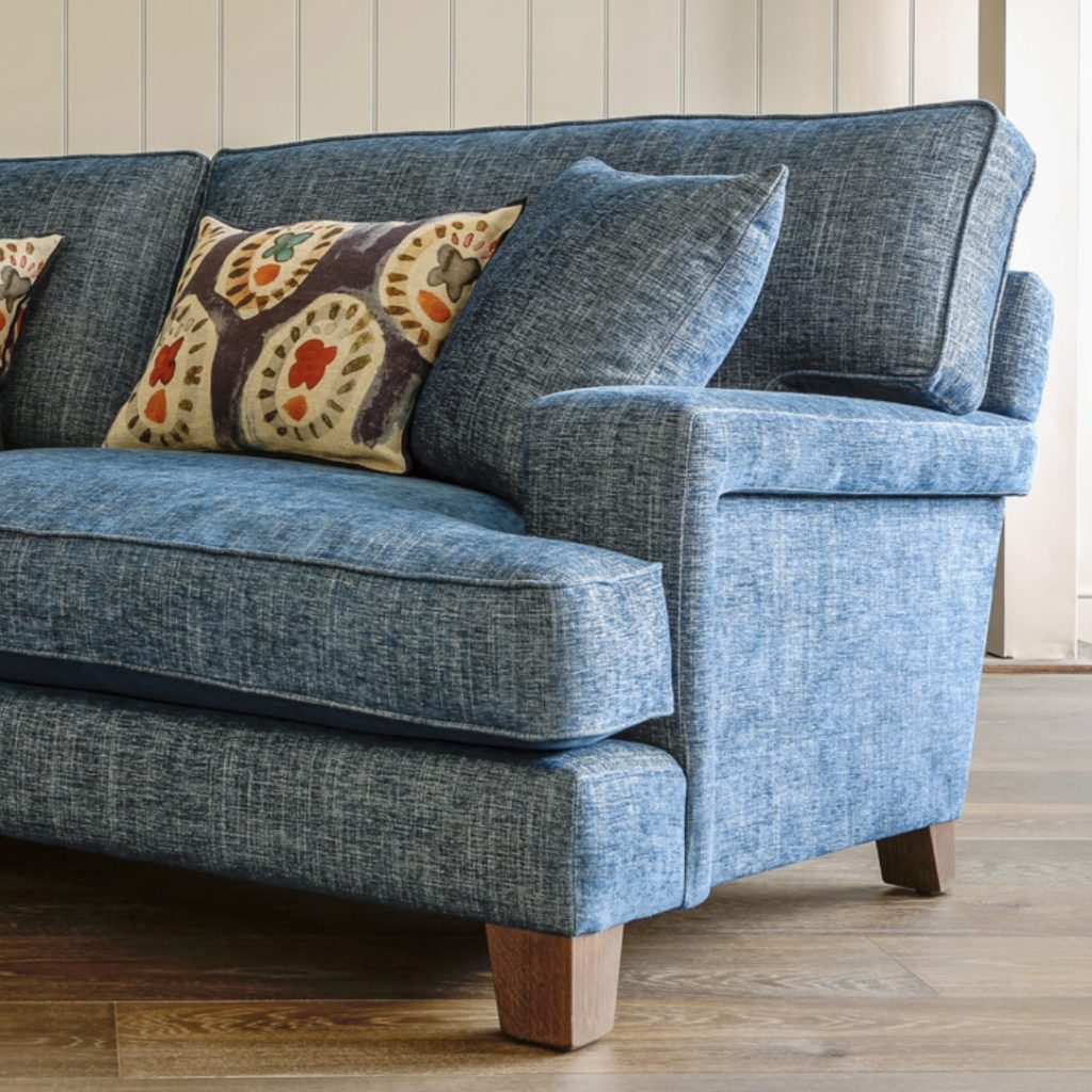 Modern classic sofa upholstered in a blue weave