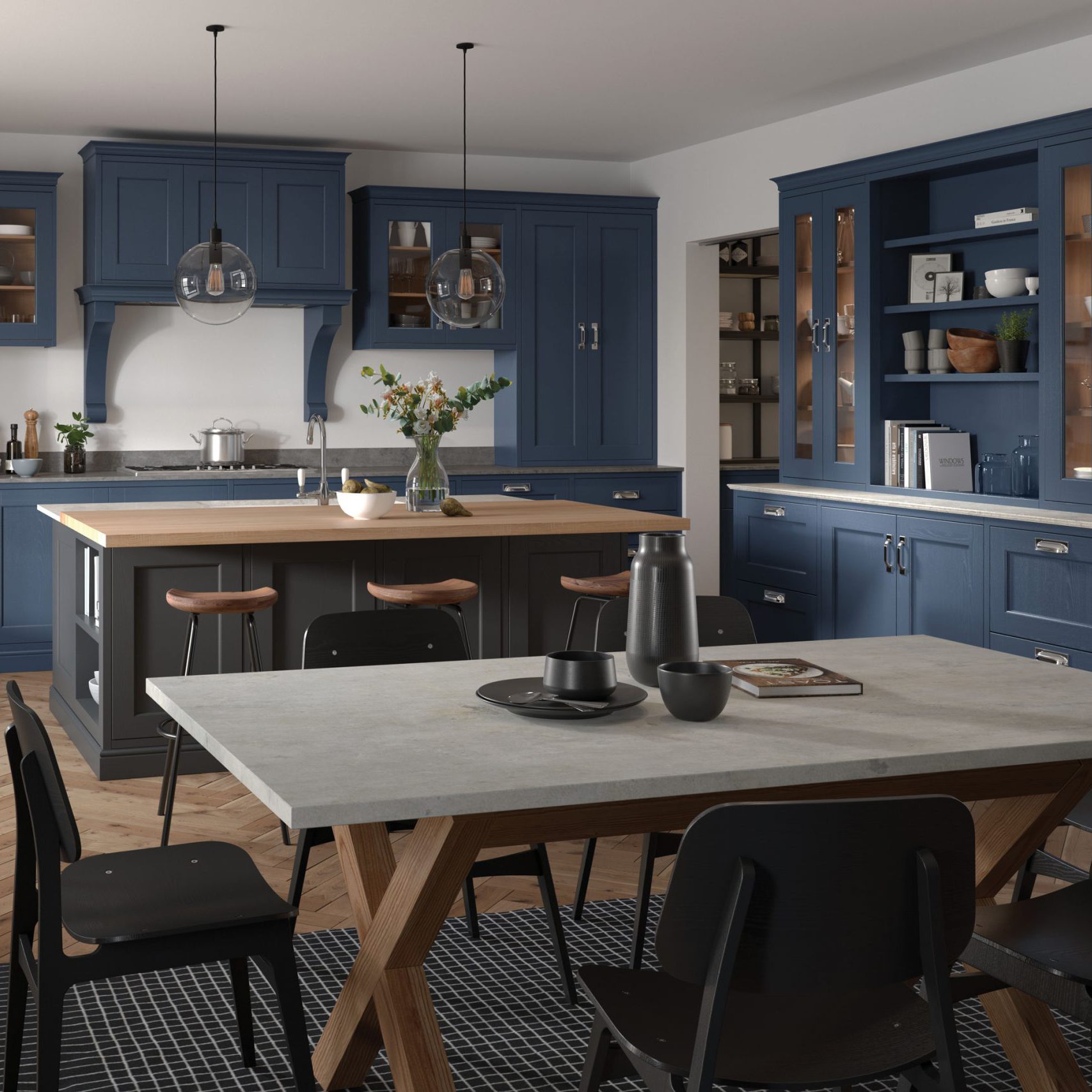 Mid blue and grey shaker kitchen with dining table and chairs in foreground
