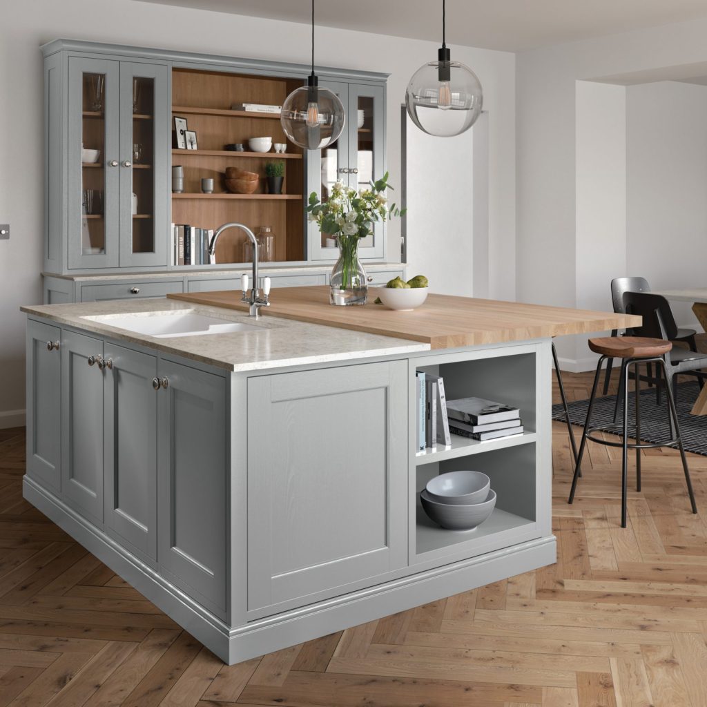Pale grey painted solid wood shaker kitchen with light oak parquet floor