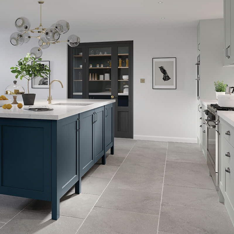 Solid wood shaker kitchen with a dark ocean blue centre island and pale grey base units