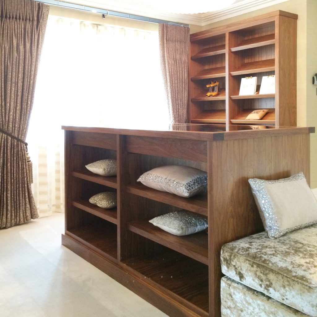 Master dressing room with fitted shelves in walnut