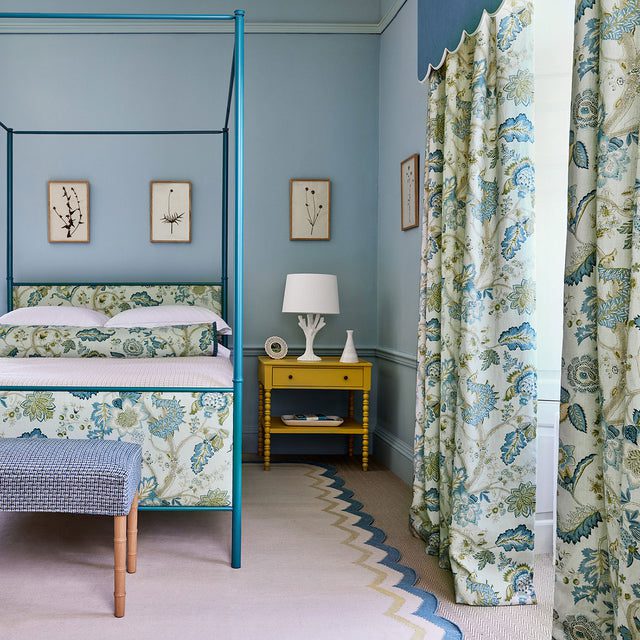 Elegant blue and green bedroom furnished with English floral linens
