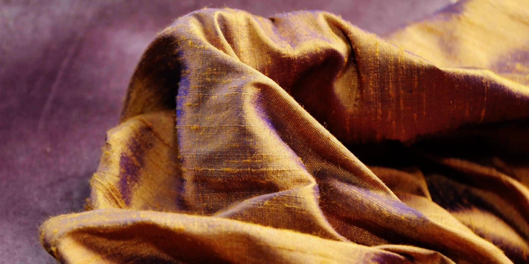 Close up of some shimmering bronze coloured raw silk fabric