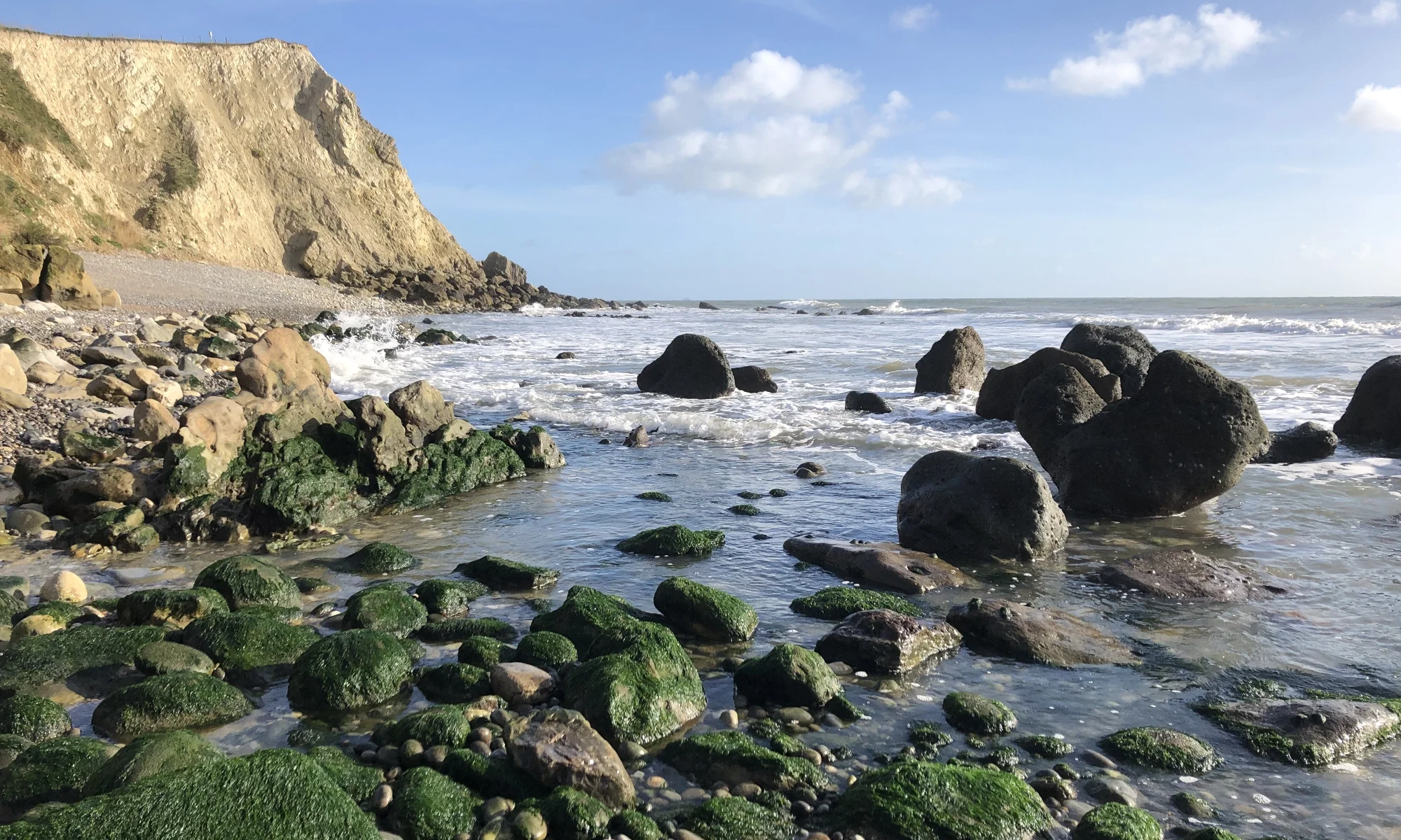 A rocky cove in sunshine